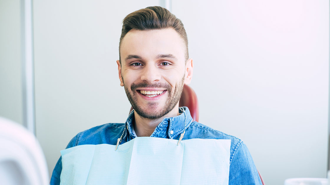 man smiling after Extractions