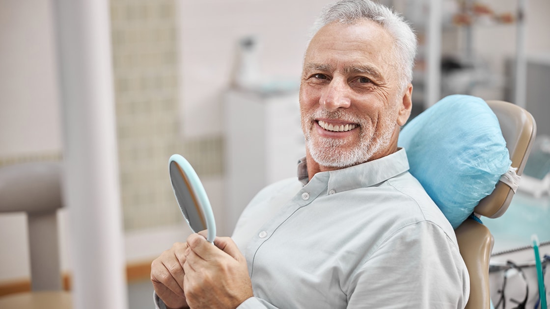 man smiling after Scaling and Root Planing